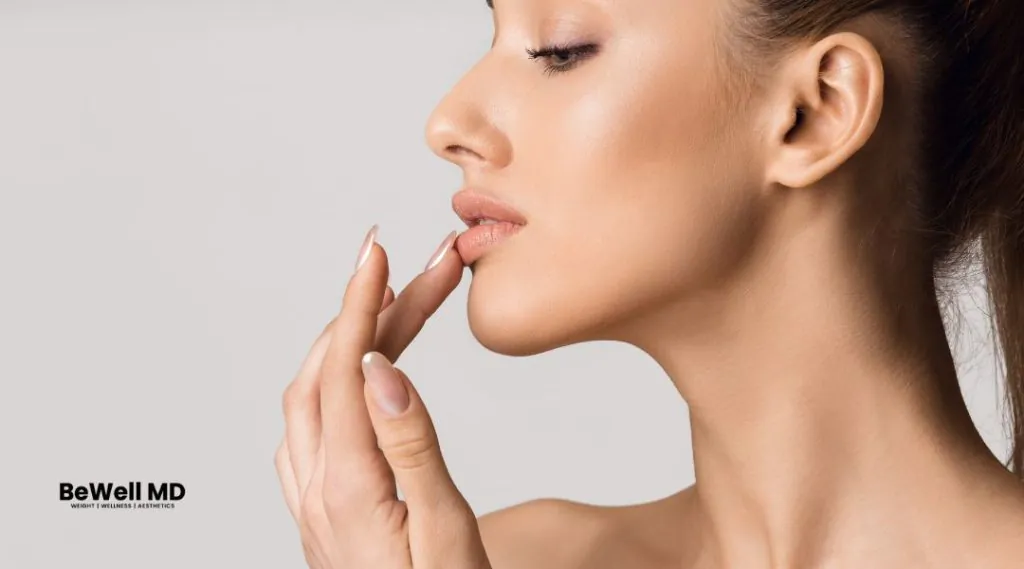 Woman touching her lips with fingers