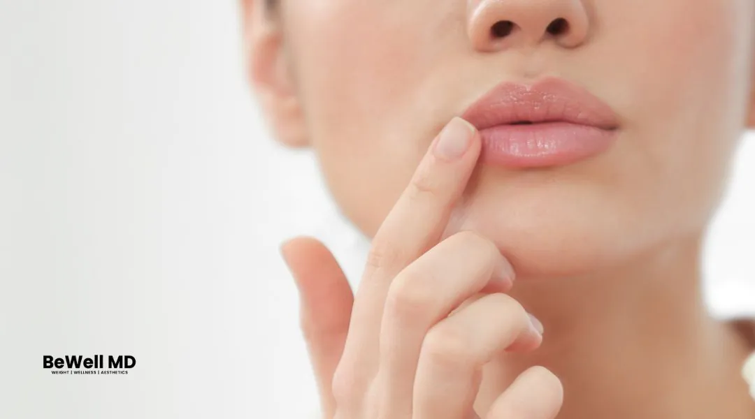 Woman touching her lips with finger